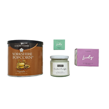Load image into Gallery viewer, Luxury popcorn, elderflower lip balm, lavender soy wax candle and chocolate face mask.
